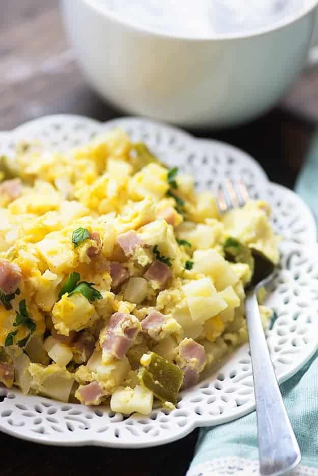This slow cooker breakfast casserole makes a great holiday breakfast or brunch and can really feed a crowd! I love the mixture of cheesy potatoes, ham, and eggs!