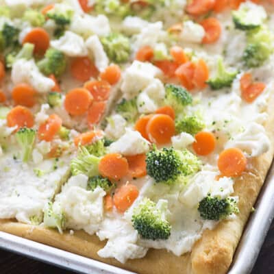 This ranch veggie pizza has a thick layer of cream cheese flavored with ranch! It's the perfect appetizer or snack!