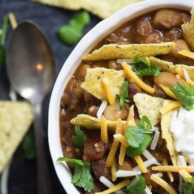 This taco chili is absolutely loaded with beans and taco meat! I topped it off with tortilla chips, cheese, and sour cream.