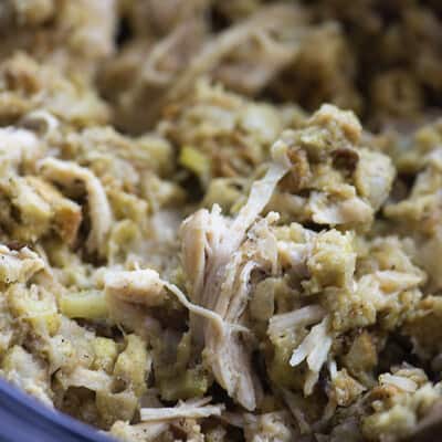 This crock pot chicken and stuffing is total comfort food! The chicken is tender and the stuffing mix cooks right in the slow cooker with the chicken!