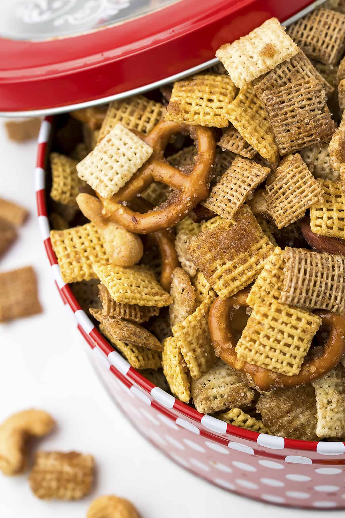 Cinnamon sugar sweet Chex mix in Christmas tin.