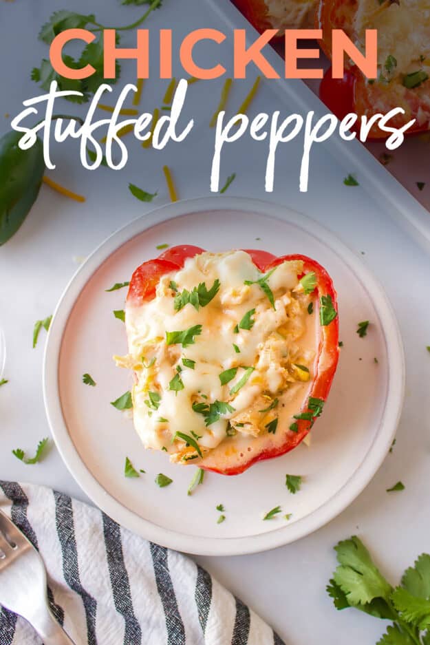 Chicken stuffed pepper on small white plate with text for Pinterest.