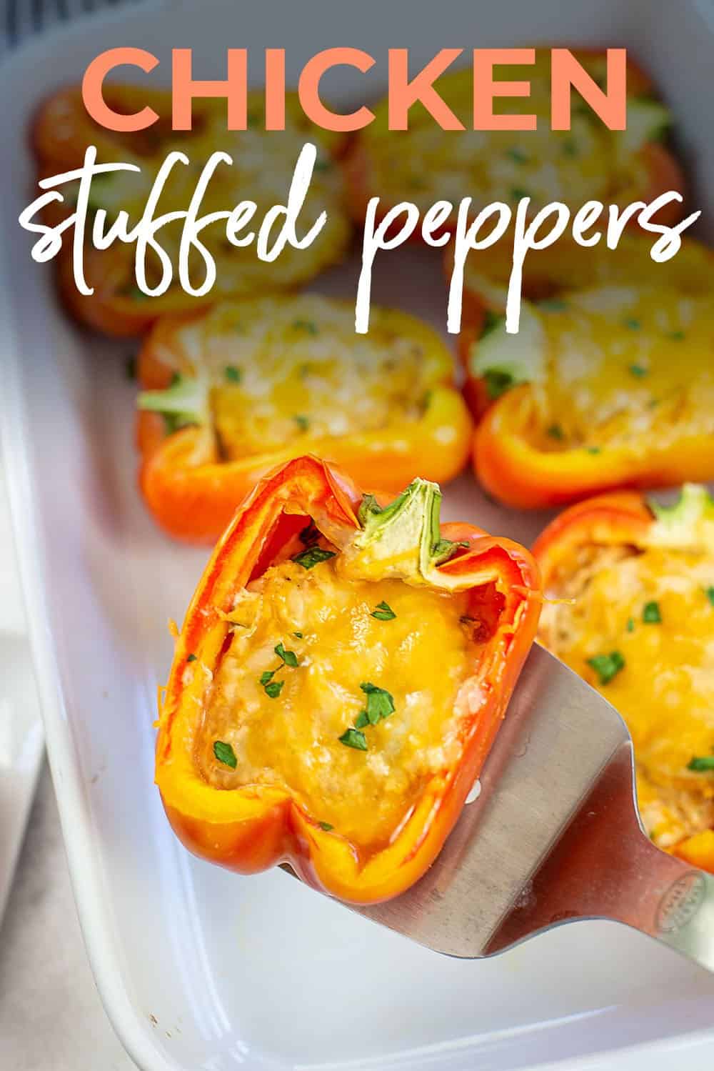 cream cheese chicken stuffed peppers in white dish.