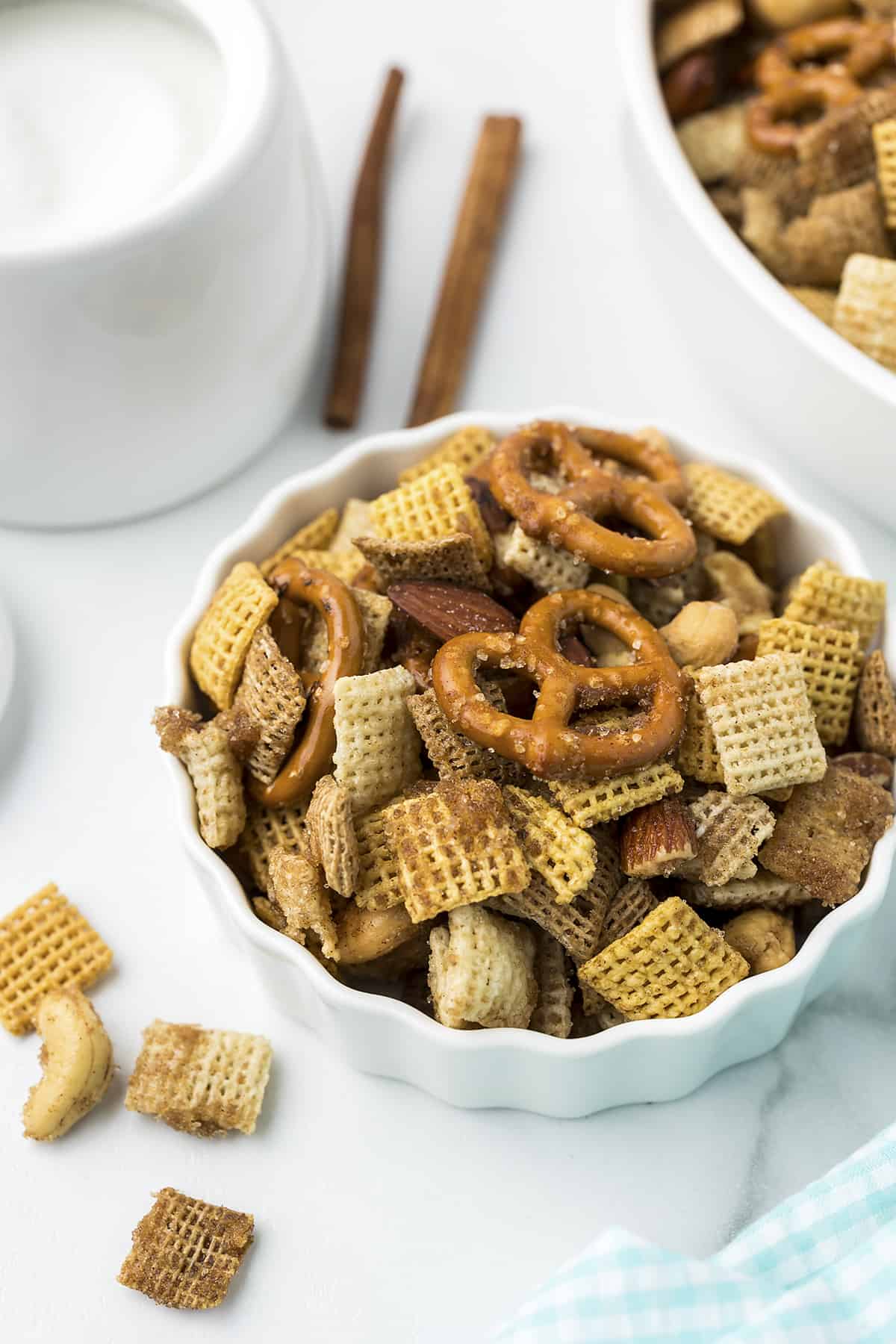 Cinnamon sugar Chex Mix in white dish.