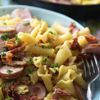 This cheesy pasta recipe is loaded with sun-dried tomatoes and smoked sausage. It's ready in about 25 minutes in just one dish!