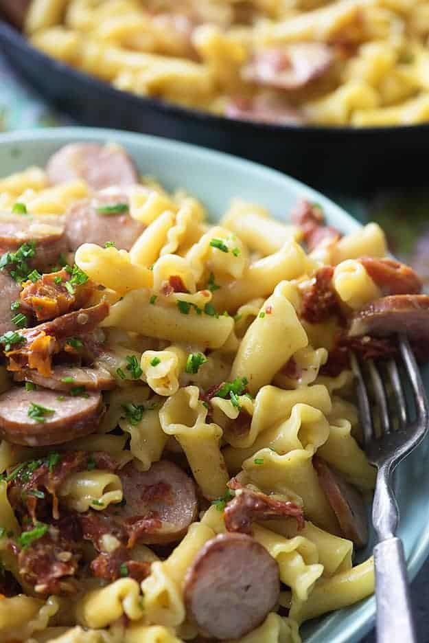 This cheesy pasta recipe is loaded with sun-dried tomatoes and smoked sausage. It's ready in about 25 minutes in just one dish!