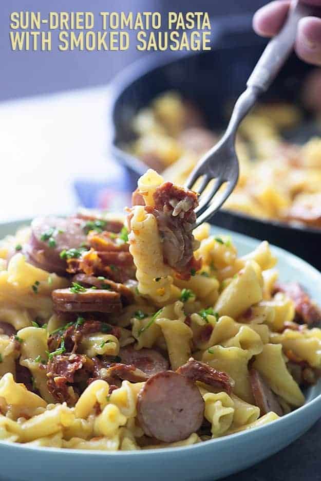 Sun-dried tomatoes, smoked sausage, and cheesy pasta! My whole family loves this one dish dinner.
