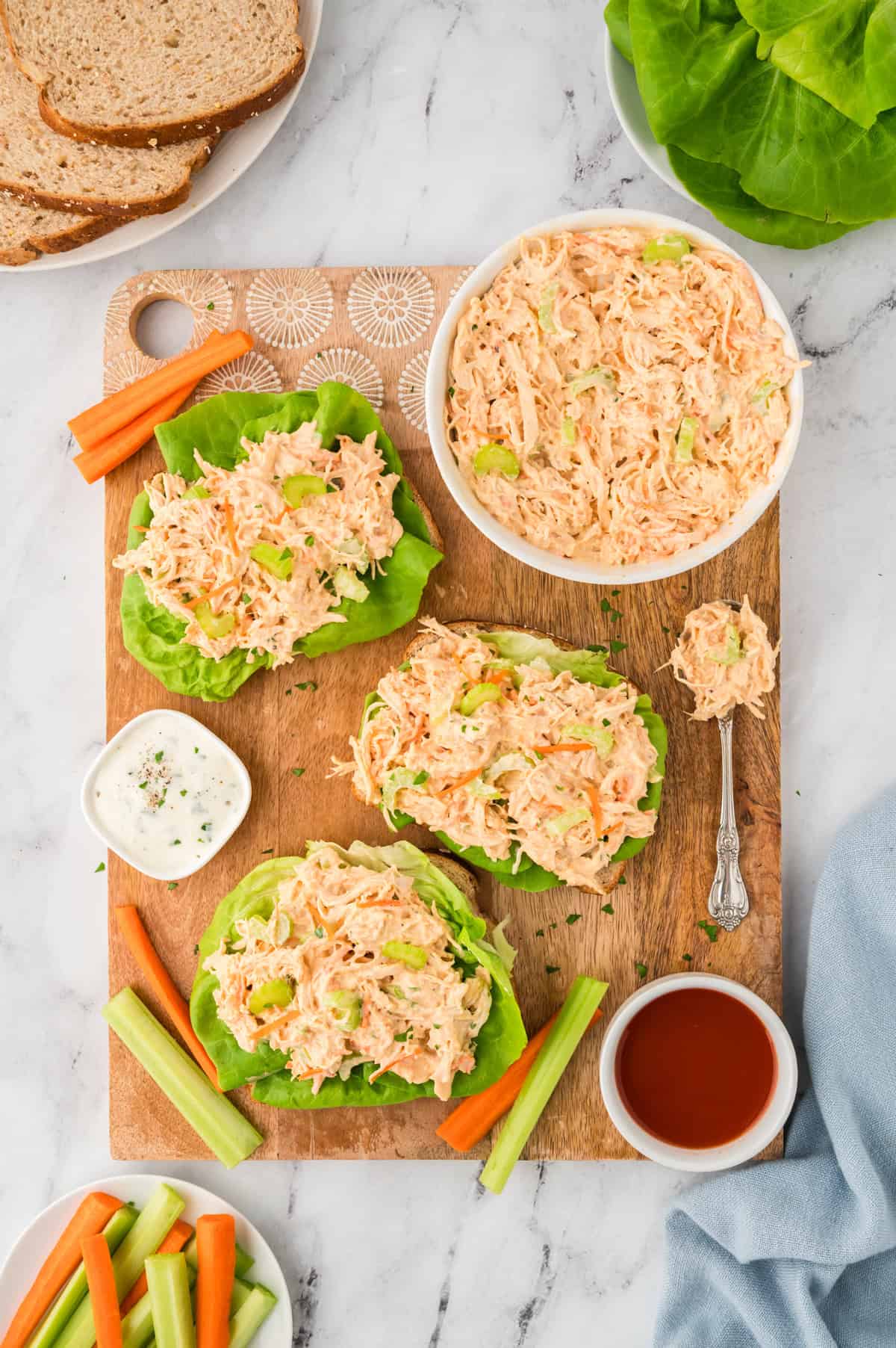 spicy buffalo chicken salad sandwich on wheat bread