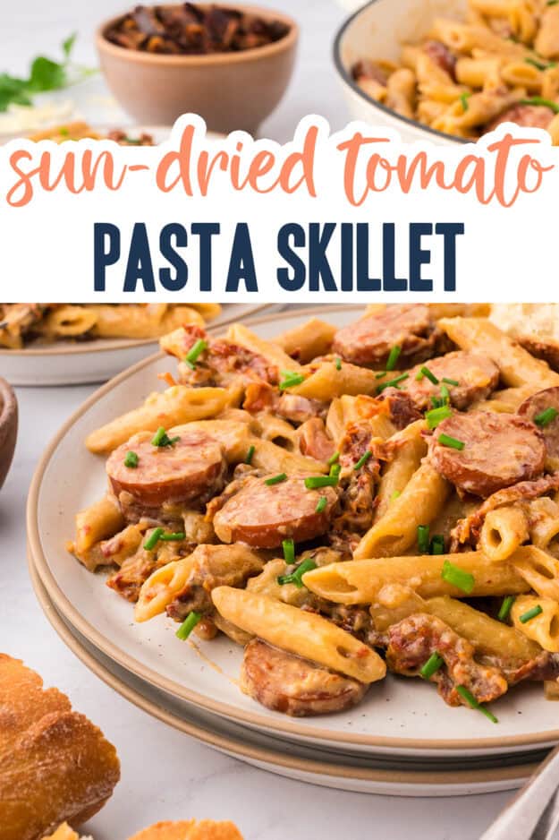 Smoked sausage and sun-dried tomato pasta on plate.
