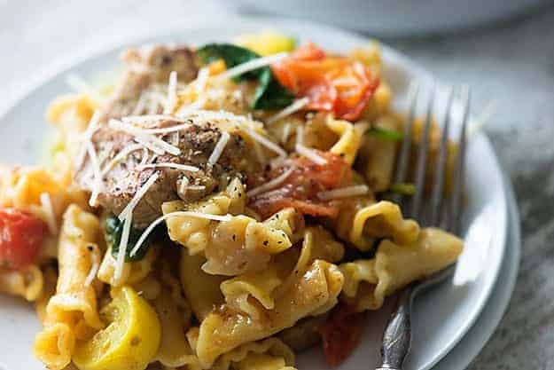 A close up of a plate of pork pasta