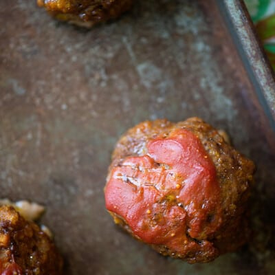 A meatloaf meatball on a baking sheet.