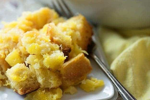 A close up of pineapple casserole on a square plate.
