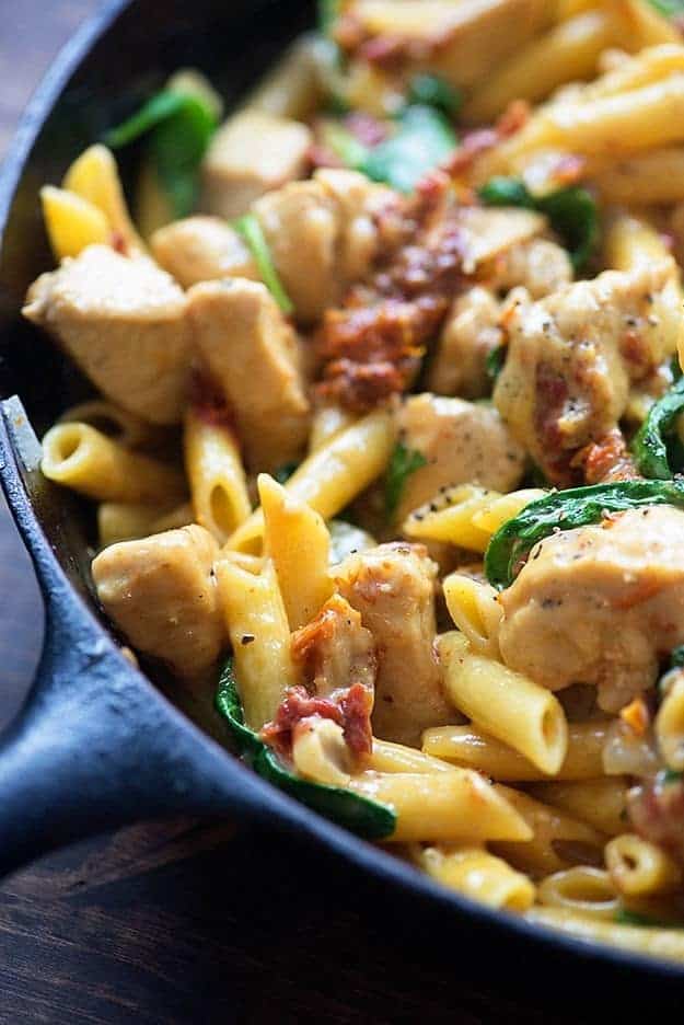 This chicken florentine pasta is made in one skillet and ready in 25 minutes. It's full of chicken, sun-dried tomatoes, and spinach!