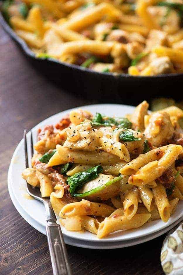 This chicken florentine pasta is made in one skillet and ready in 25 minutes. It's full of chicken, sun-dried tomatoes, and spinach!