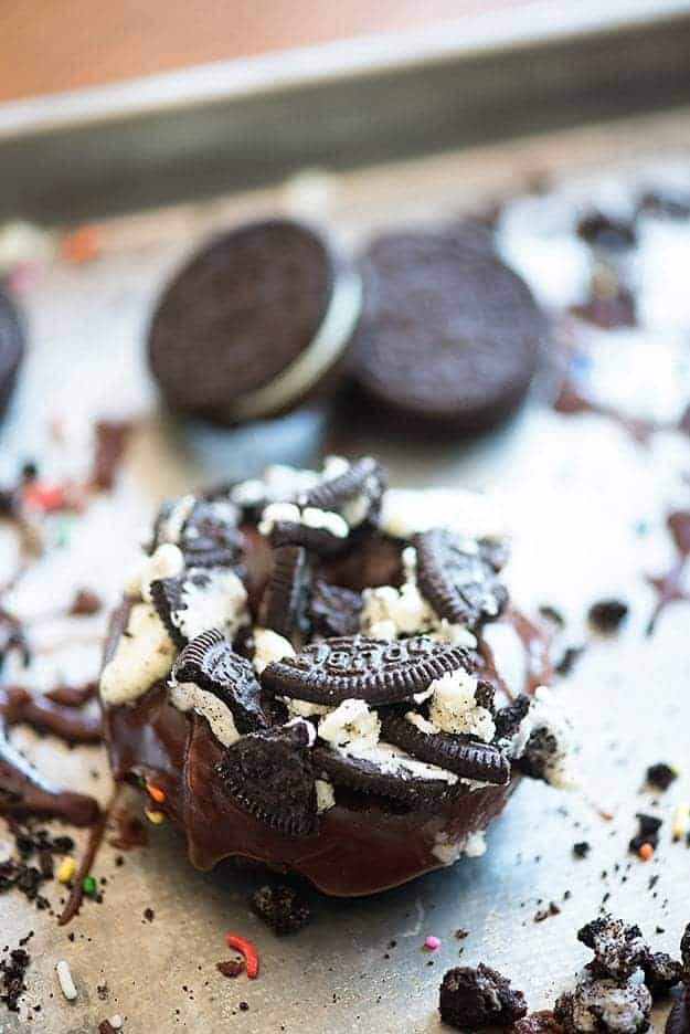 Oreo topped donut un front of stacked up oreos.