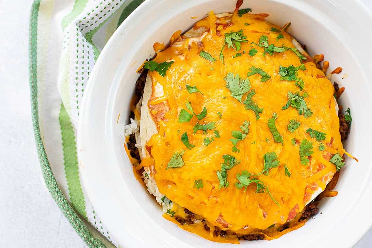 baked burrito pie in white dish.