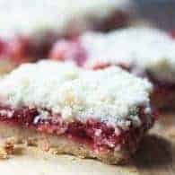 These cherry pie bars have gooey cherry pie filling surrounded by a simple three ingredient crust!