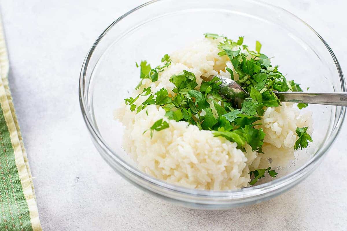 cilantro and rice in glass bowl.