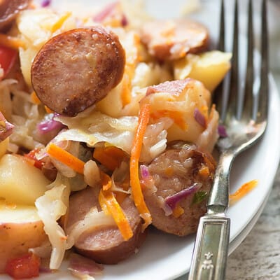 This fried cabbage recipe is packed with smoked sausage and potatoes and tossed in a tangy sauce!