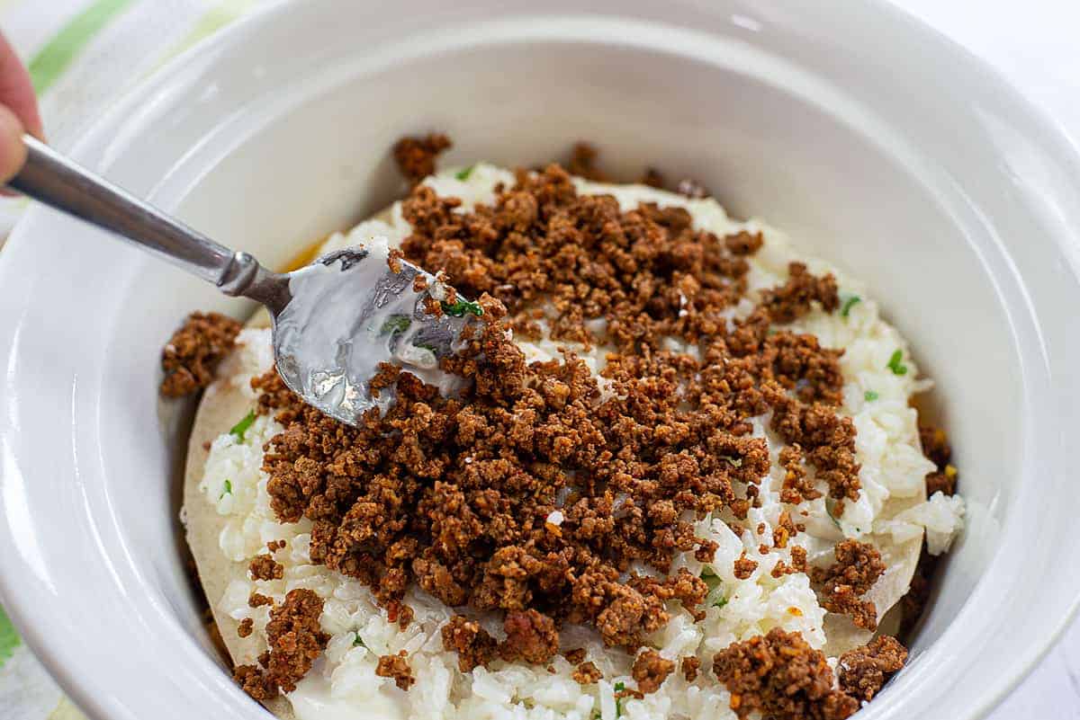 layering beef in casserole dish.