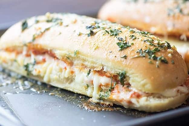 A pizza bread sandwich on a baking sheet.