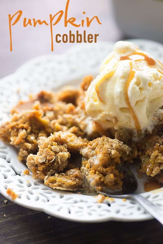 A decorative white plate of pumpkin cobbler with ice cream on top.