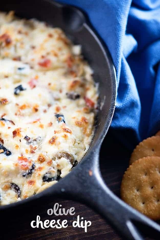 Olive cheese dip in a cast-iron skillet.