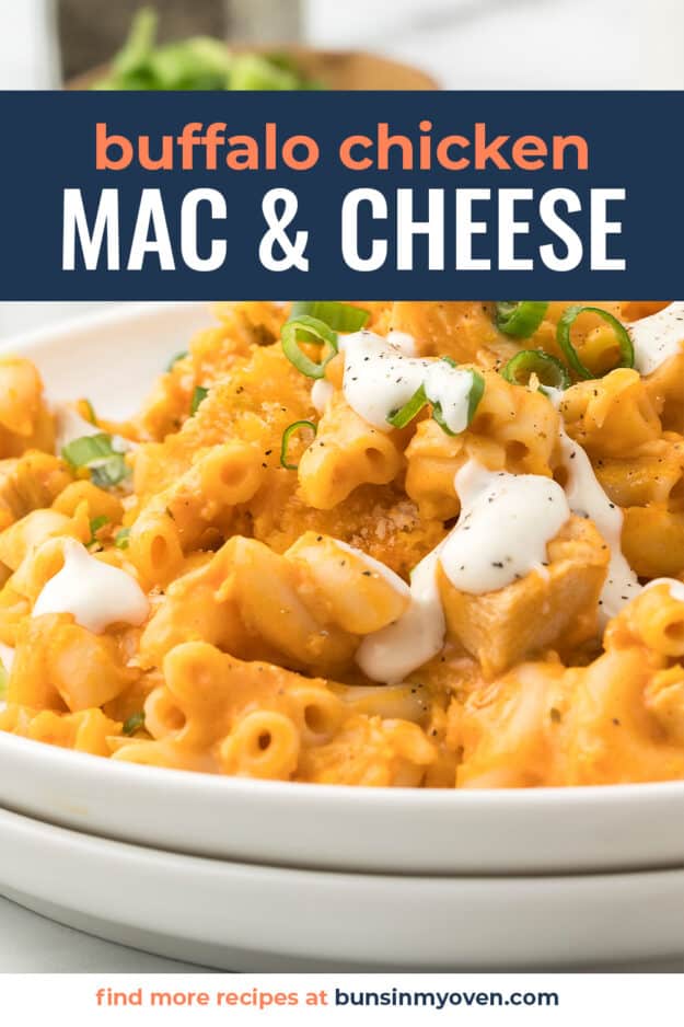 Buffalo chicken macaroni and cheese with ranch dressing drizzled over the top on a small plate.