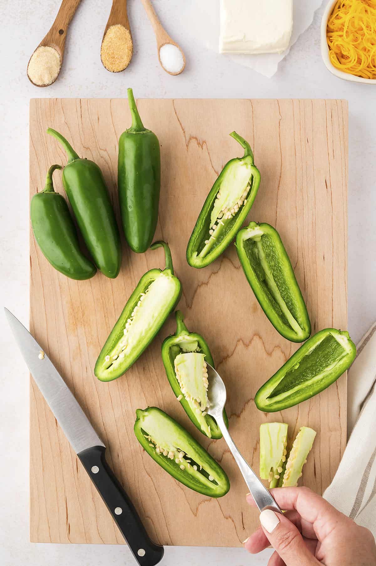 Jalapenos sliced in half and seeded.