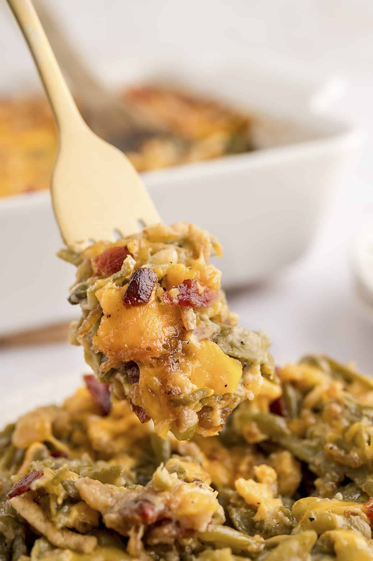 Fork full of green bean casserole recipe.