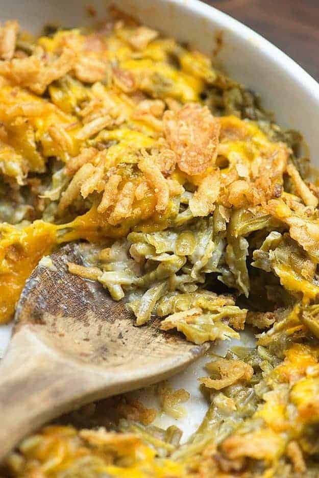 green bean casserole with bacon in white dish