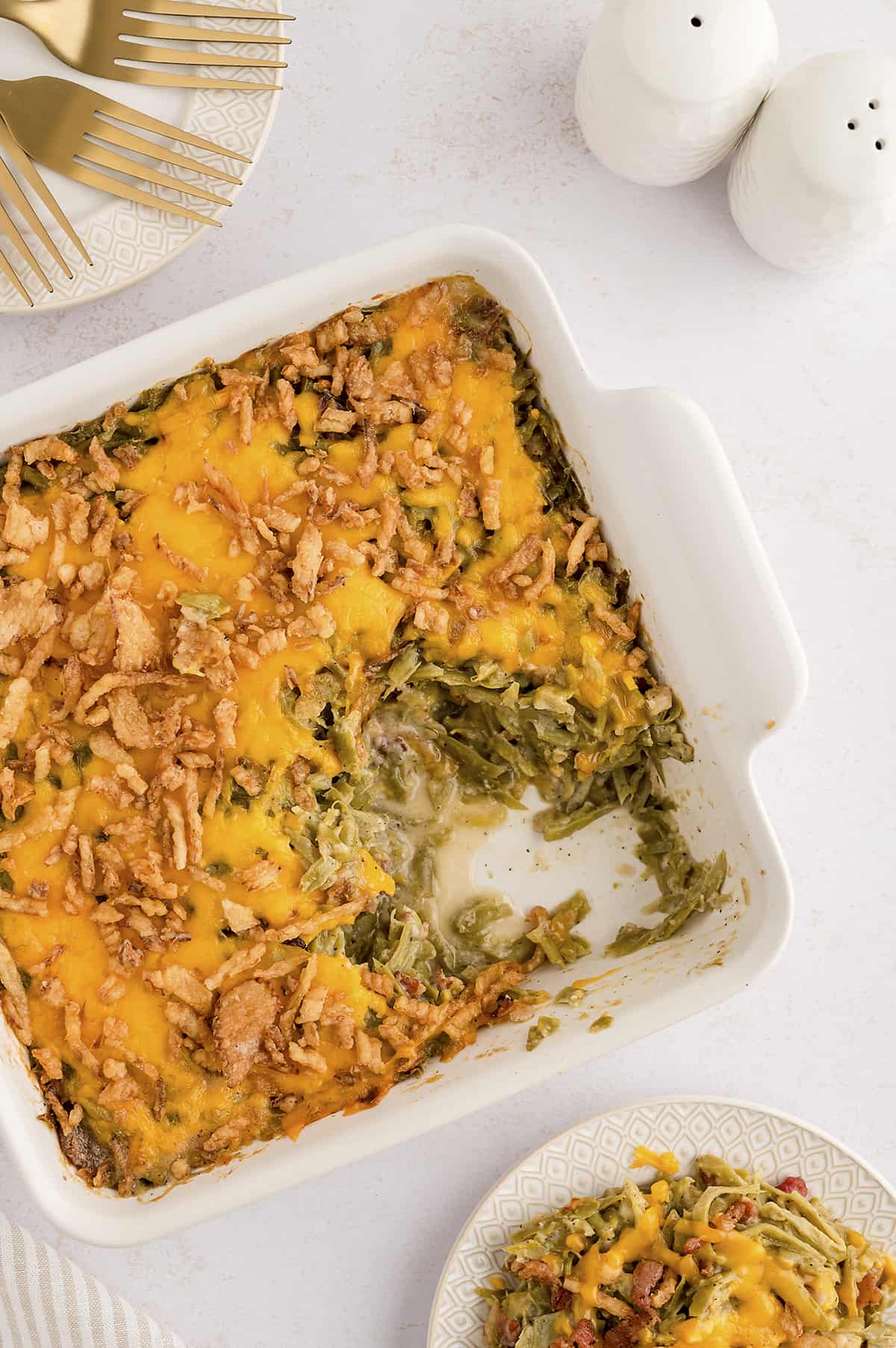 Overhead view of made from scratch green bean casserole in white baking dish.