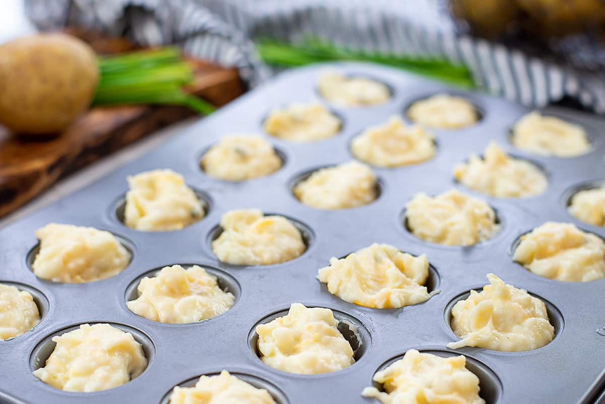 mashed potato puffs in mini muffin tin.