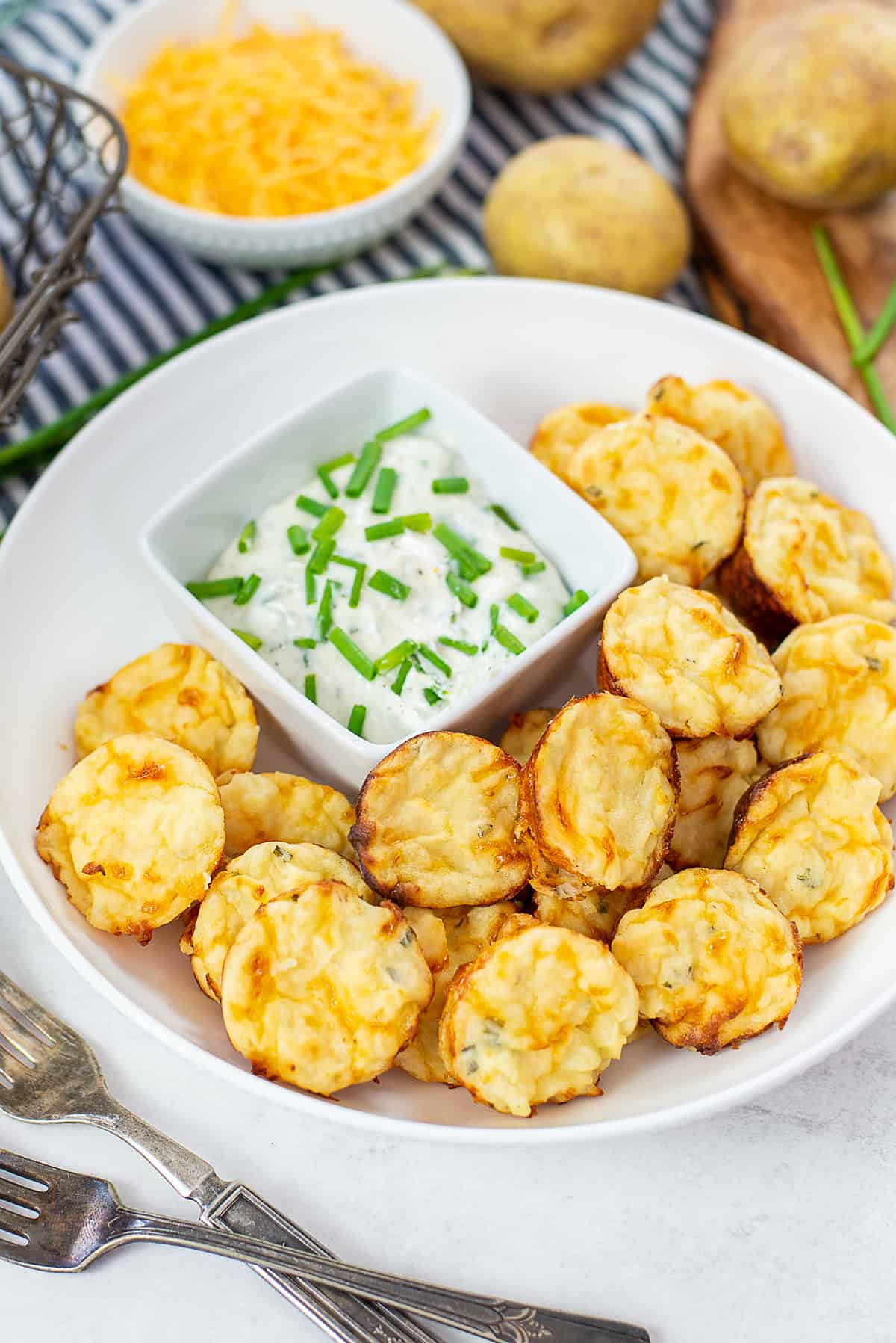 mashed potato puffs in white bowl with ranch.