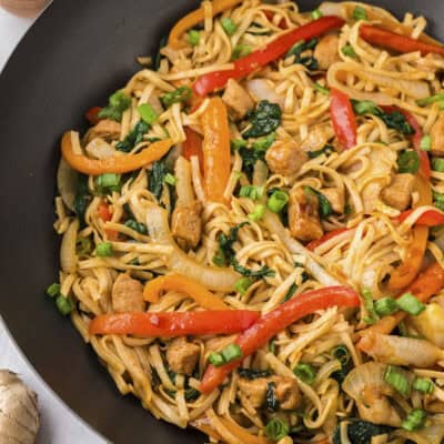 Pork lo mein in wok.