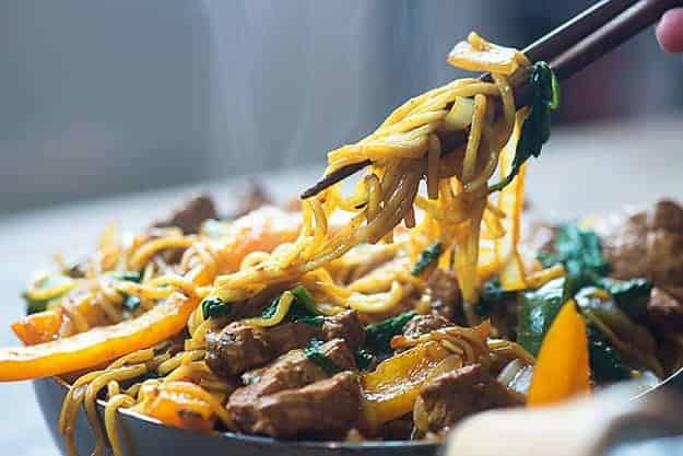 This easy lo mein recipe is full of pork, bell peppers, onions, and spinach. It's ready in less than 30 minutes and even tastier than take out!