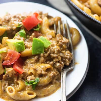 A white plate of taco pasta.