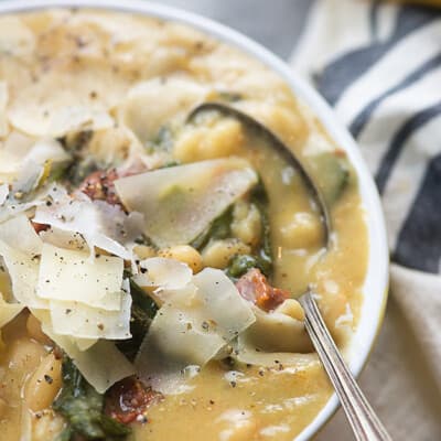 This Tuscan White Bean Soup is the perfect slow cooker soup! It's loaded with white beans, spinach, and sun-dried tomatoes.