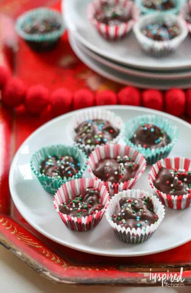 wrapped chocolate candies on a white plate.