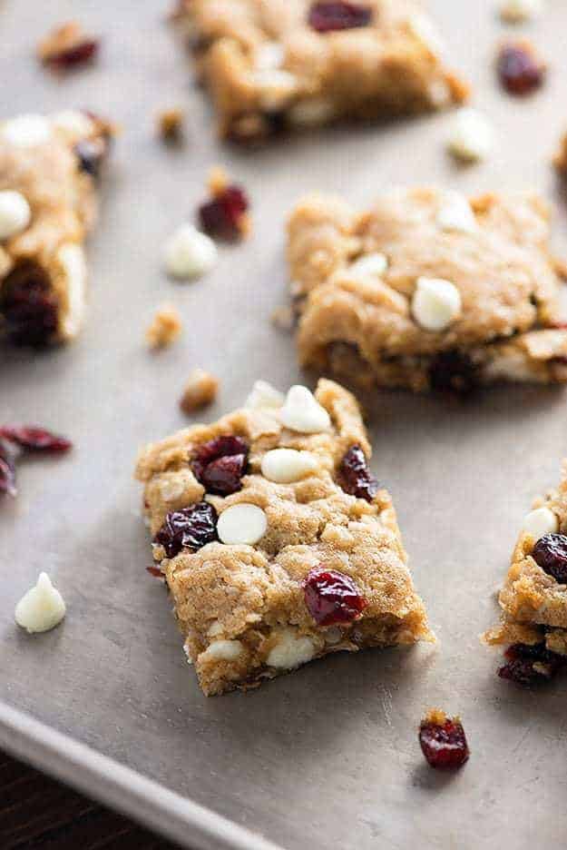 Small oatmeal bar squares on a baking sheet.