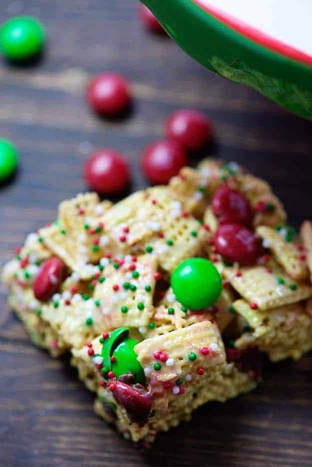 A close up of a piece of a cereal square on a cutting board.