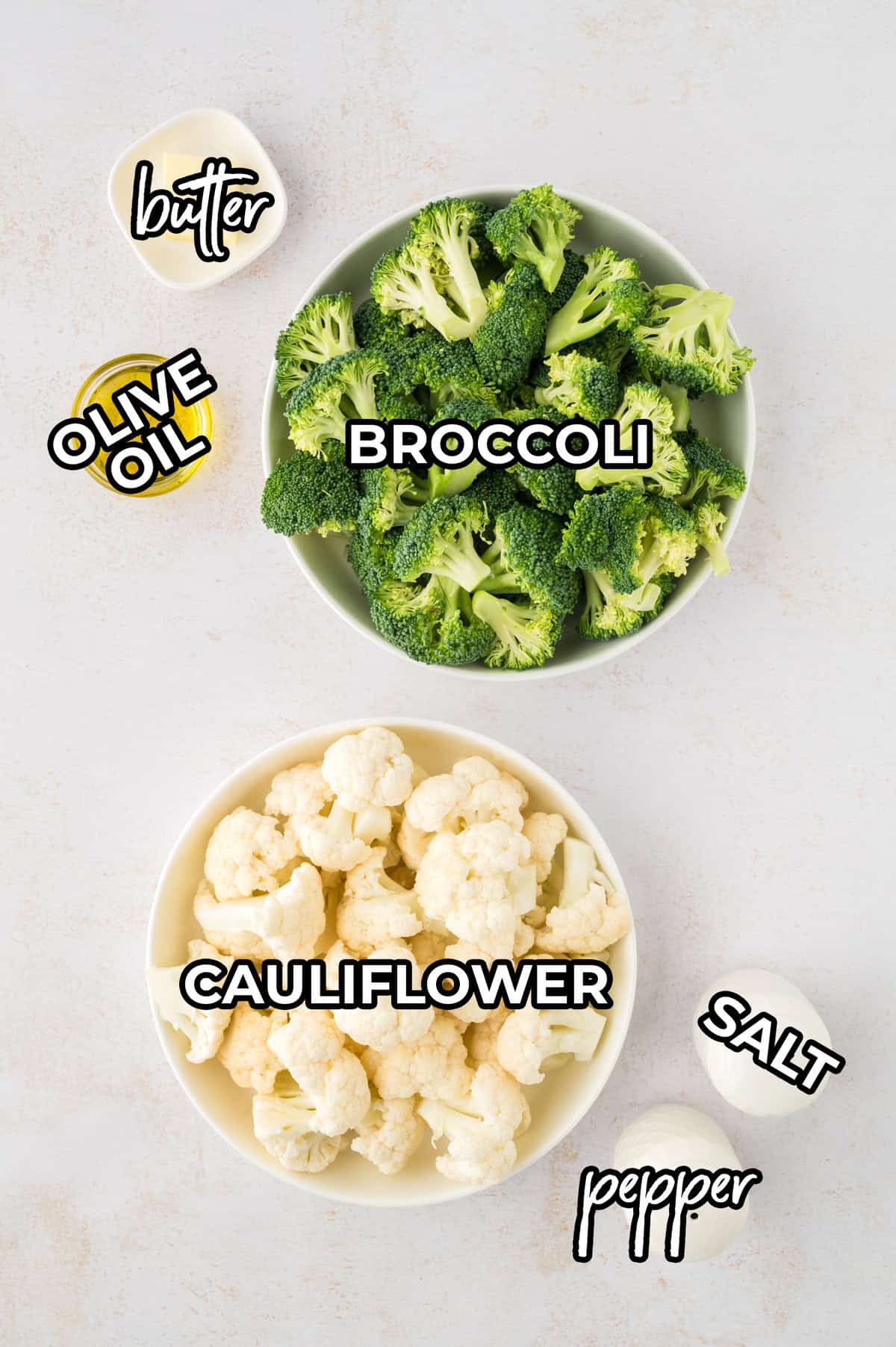 Ingredients for roasted broccoli and cauliflower on counter.