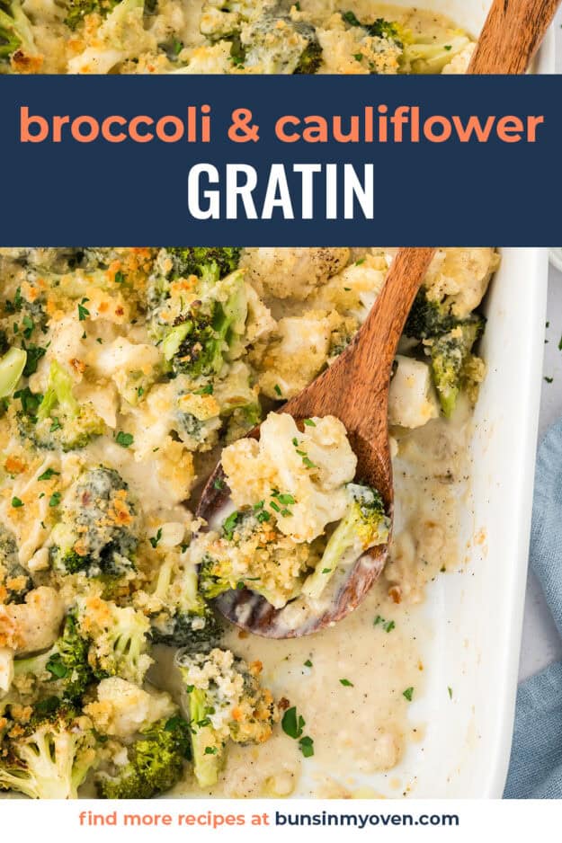 Wooden spoon scooping up broccoli and cauliflower au gratin from 9x13 baking dish.