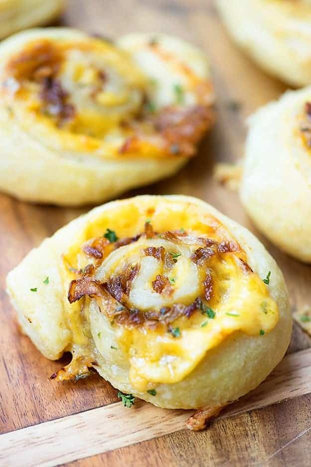 Close up of a cheesy pinwheel pastry.