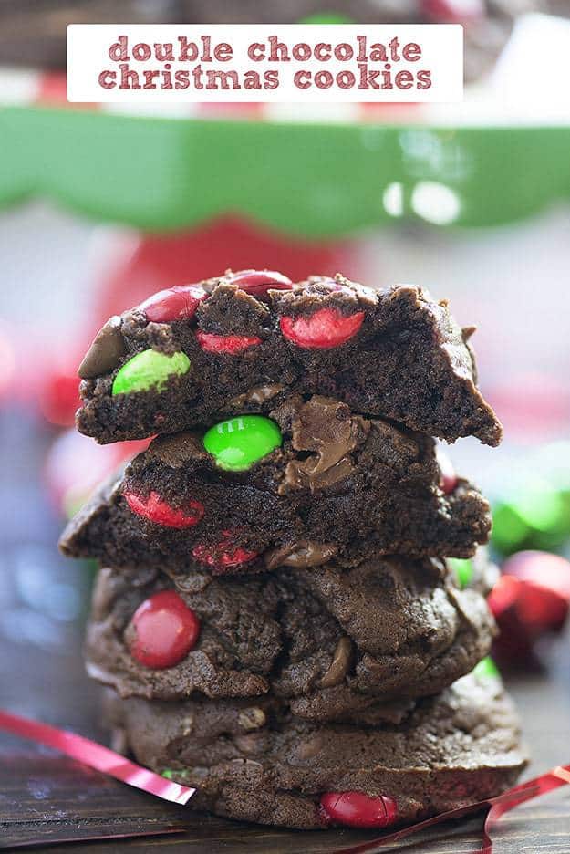 stack of chocolate christmas cookies with holiday candies.
