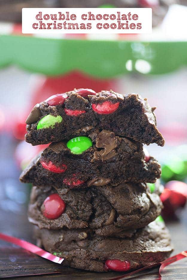 stack of chocolate christmas cookies with holiday candies.