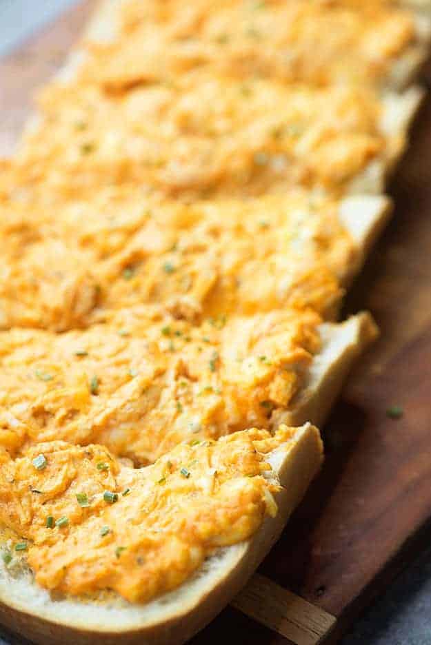 Buffalo chicken dip is one of my favorites! I spread this easy buffalo chicken dip recipe on some French bread and baked it up.