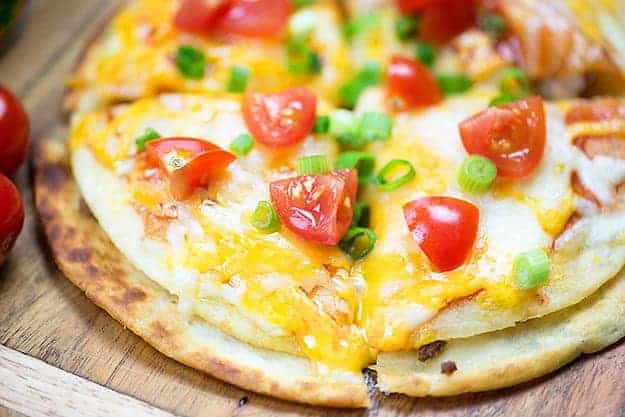 My Mexican pizza recipe is such a simple way to get dinner on the table or feed a hungry crowd! Makes a great snack or lunch.