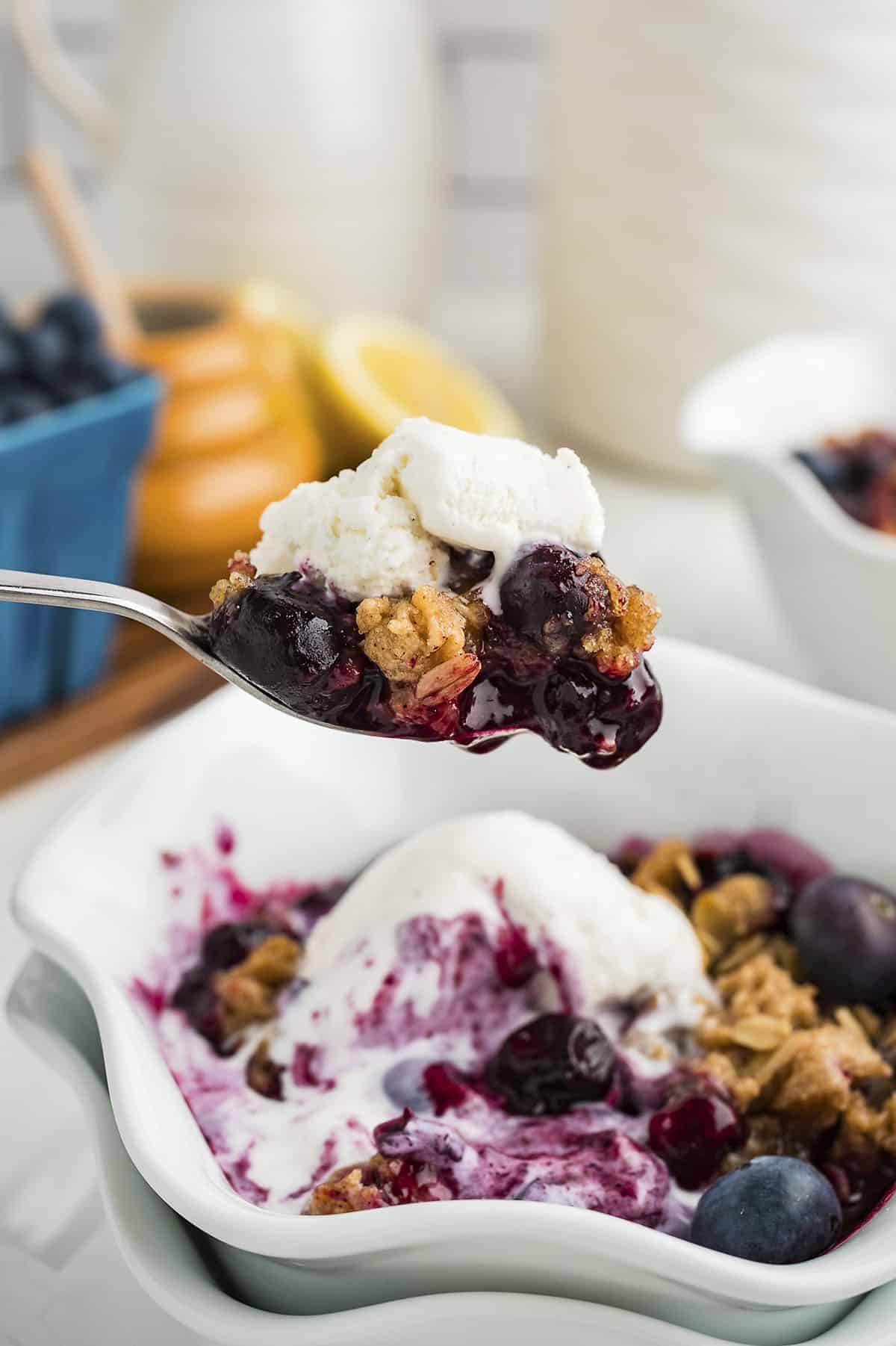 Spoonful of blueberry crisp.