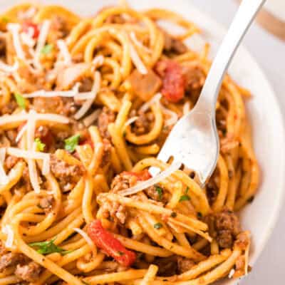 Forkful of one pot spaghetti recipe on plate.